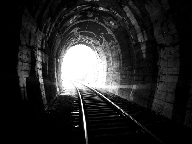 Light on the end of railway tunnel.